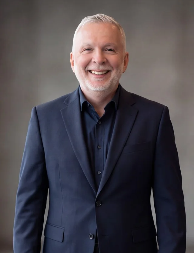 AI-generated portrait of Stéphane Lepain in a navy suit